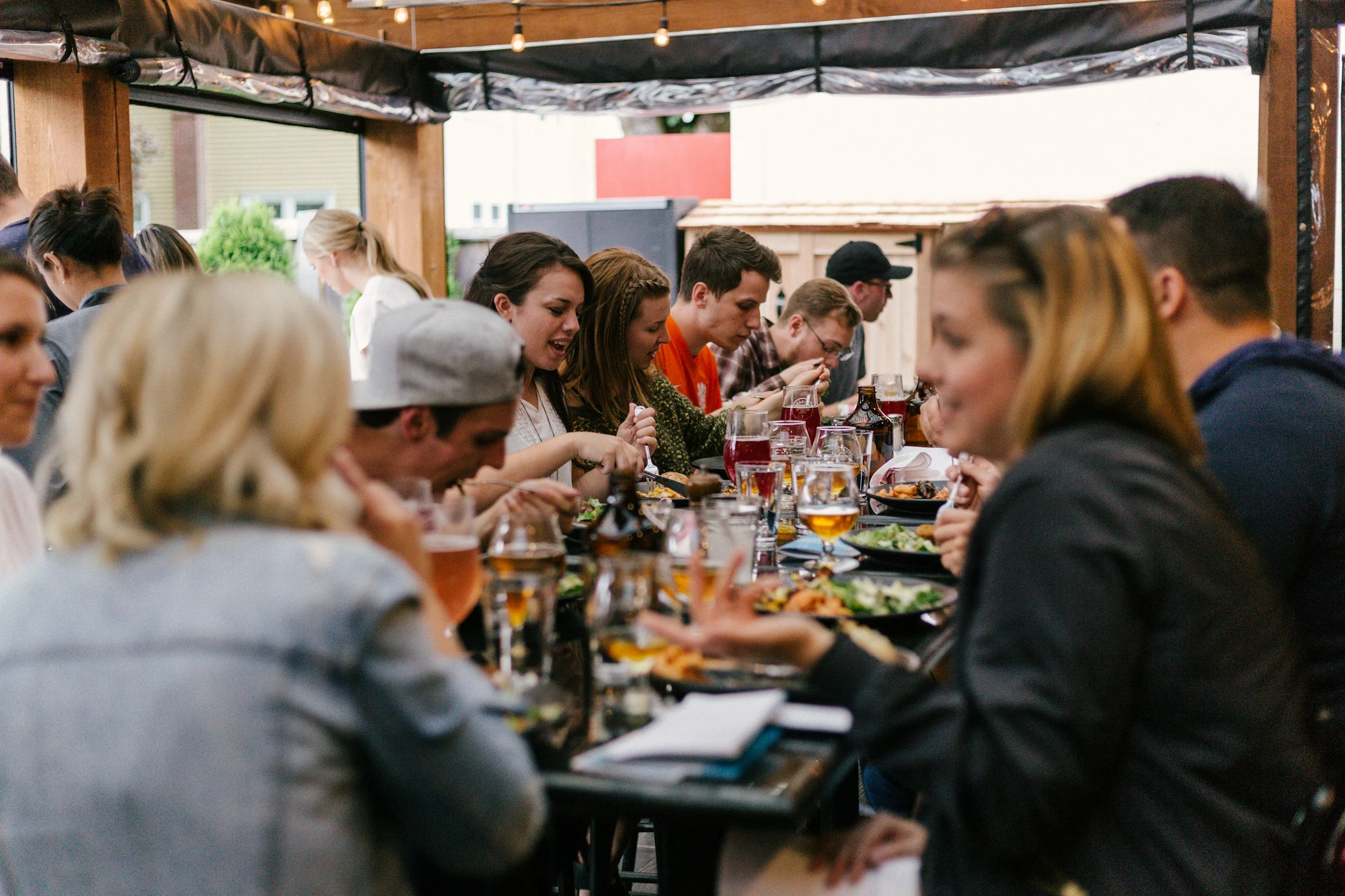 People sharing a meal and conversation around a table
